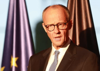 Potret Kanselir Jerman Friedrich Merz dengan latar bendera